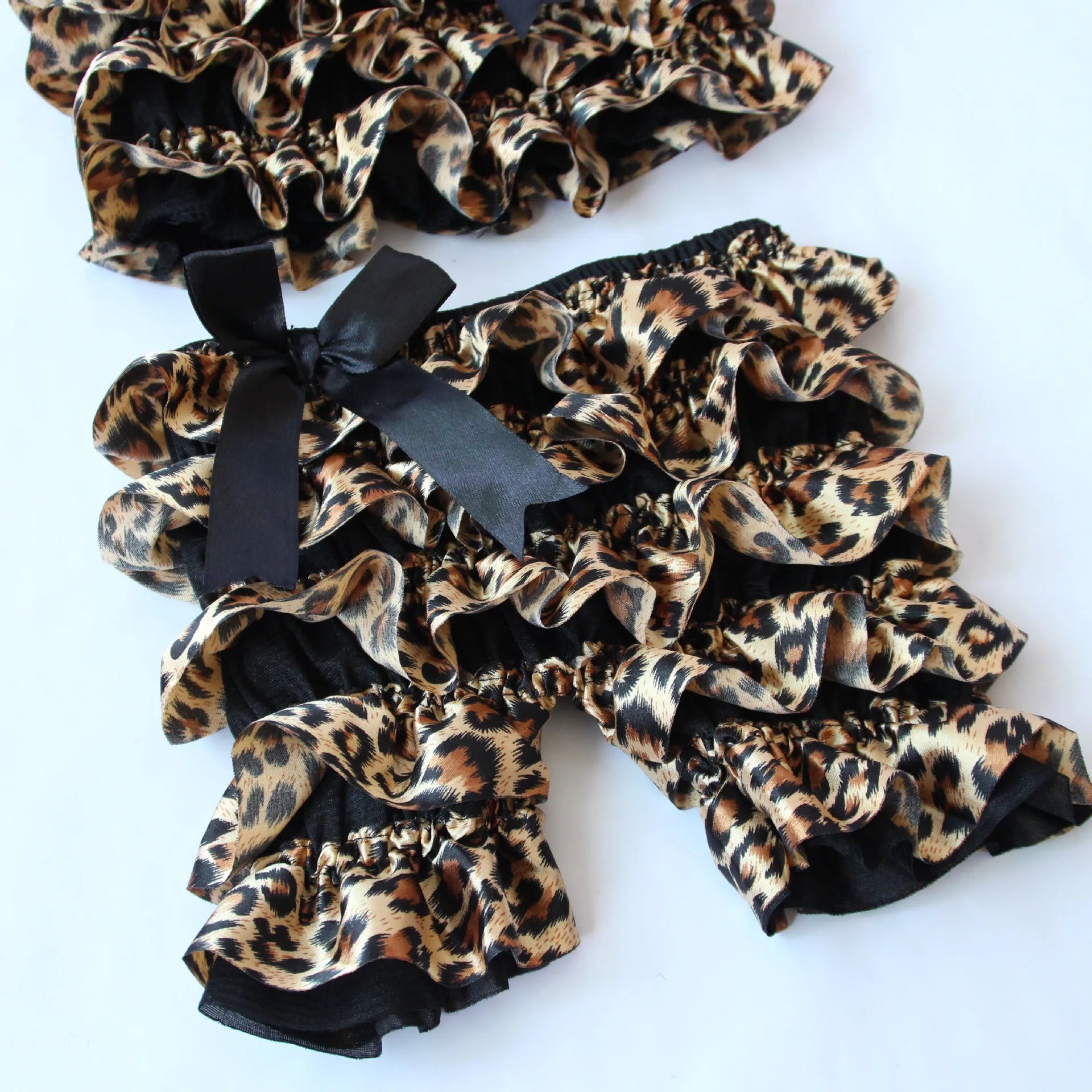 Hot Selling Toddler Fashion Summer Leopard Satin Costume Sling Ruffle Girls Baby Split Rompers Black Bow Children Clothing Suit